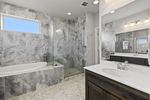 a bathroom with a sink double vanity and a mirror