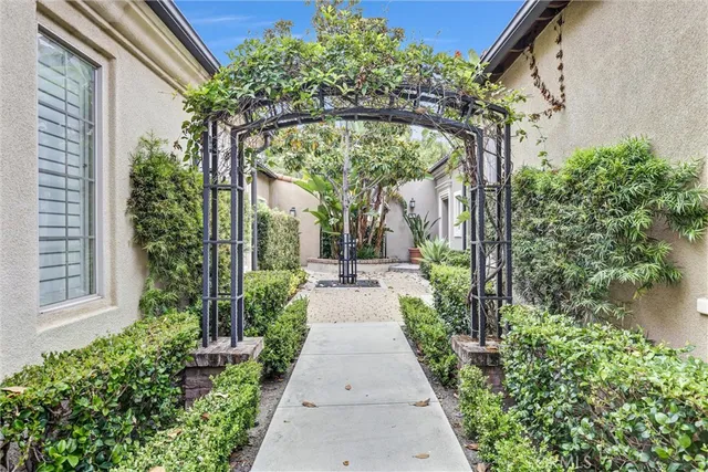 a view of a pathway both side of the house