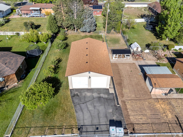 377 North 650 East, Unit 9 Orem, UT 84097 - Photo 2 of 9 Detached garage featuring dual bay doors and a brown shingle roof