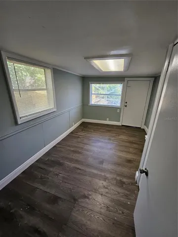 en empty room with windows