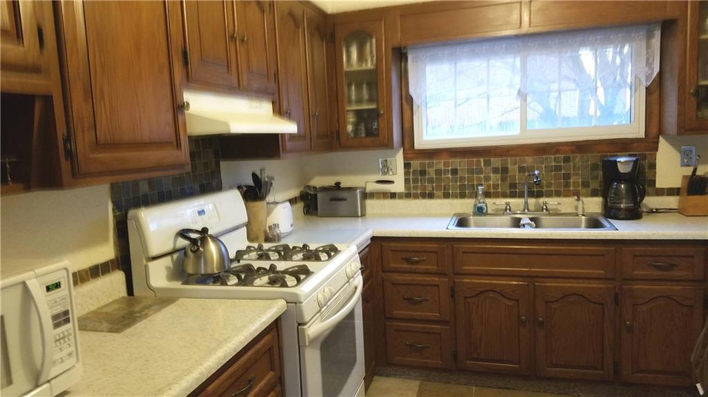 1012 Church Street Ruffs Dale, PA 15679 - Photo 5 of 22 A view of the kitchen with nice backsplash.