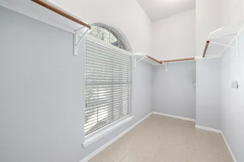 a view of empty room with windows