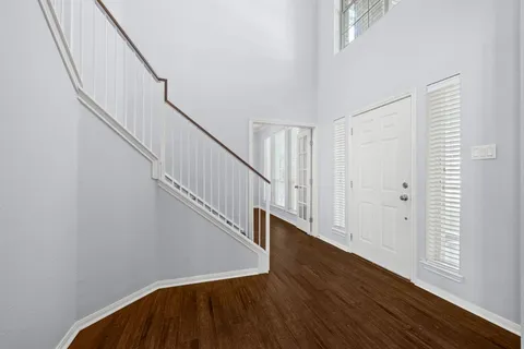 a view of entryway with wooden floor