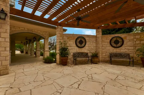 a view of a refrigerator and a table in a patio