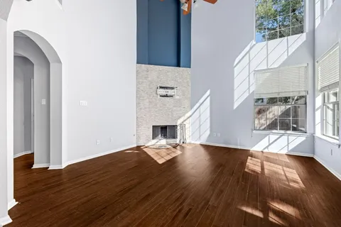a view of a floor to ceiling window and wooden floor