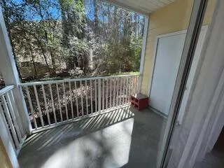 a view of balcony with wooden floor