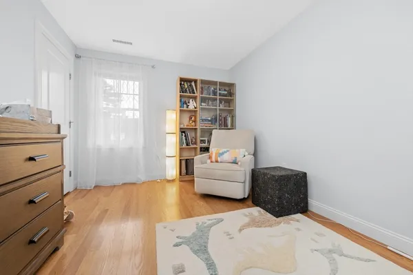 a bedroom with furniture and a window