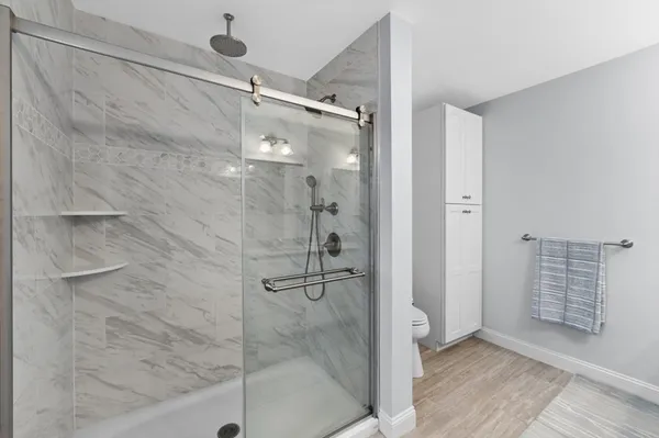 a bathroom with double sink and a mirror