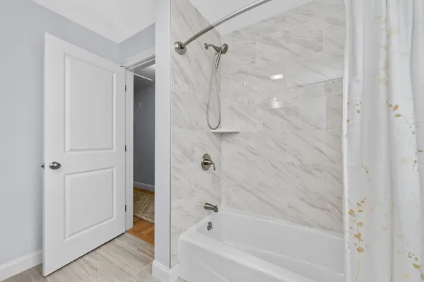 a bathroom with a granite countertop sink a toilet and a mirror