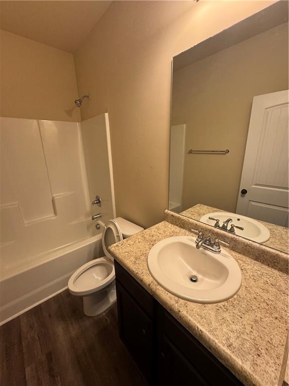 2287 Church Street Hampton, GA 30228 - Photo 5 of 11 a bathroom with a granite countertop sink toilet and shower