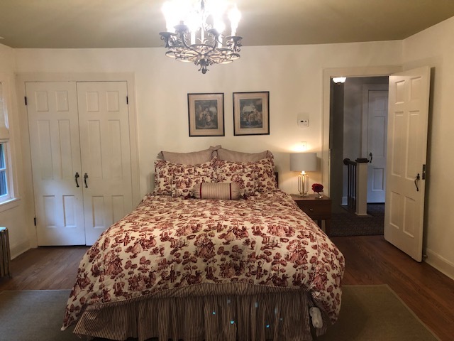 200 Oak Terrace Lake Bluff, IL 60044 - Photo 15 of 18 a bedroom with a large bed and a chandelier