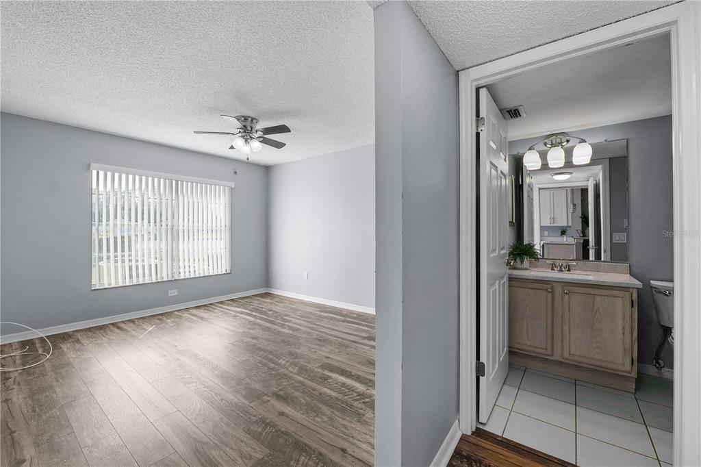 4515 Whitton Way, Unit 117 New Port Richey, FL 34653 - Photo 18 of 35 a view of an empty room with window and wooden floor