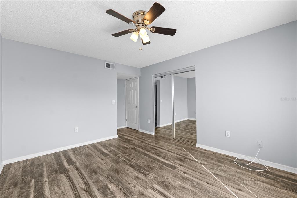4515 Whitton Way, Unit 117 New Port Richey, FL 34653 - Photo 20 of 35 a view of room with a ceiling fan