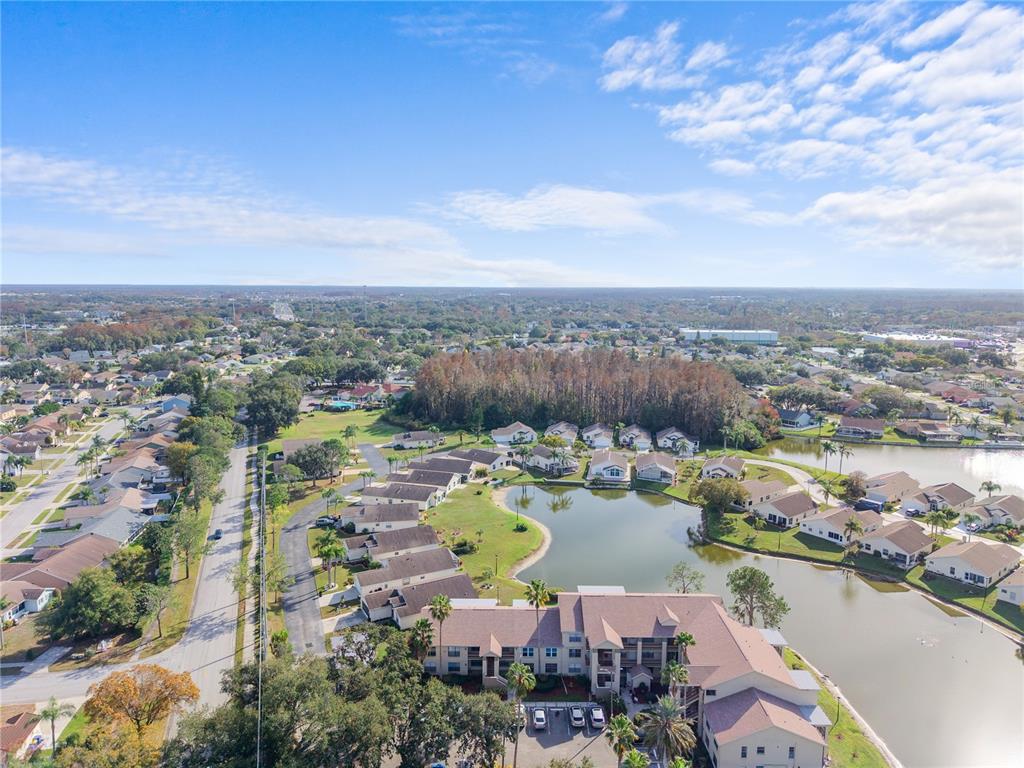 4515 Whitton Way, Unit 117 New Port Richey, FL 34653 - Photo 28 of 35 an aerial view of ocean and residential houses with outdoor space