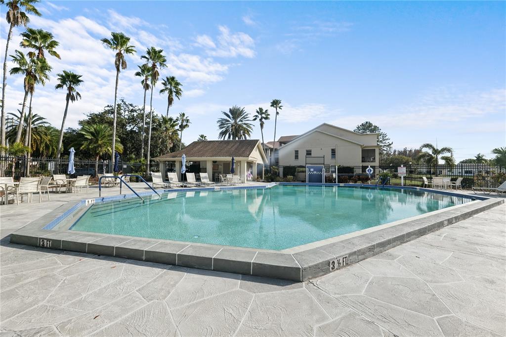 4515 Whitton Way, Unit 117 New Port Richey, FL 34653 - Photo 33 of 35 a view of swimming pool with a garden