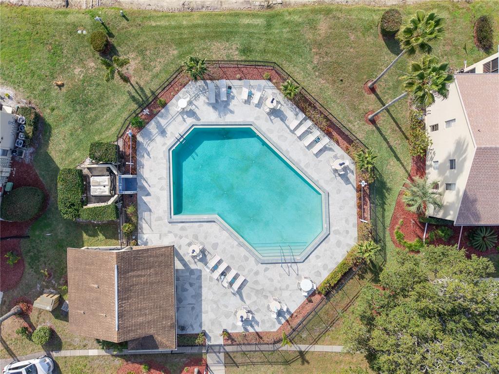 4515 Whitton Way, Unit 117 New Port Richey, FL 34653 - Photo 35 of 35 an aerial view of a house with a garden and lake view