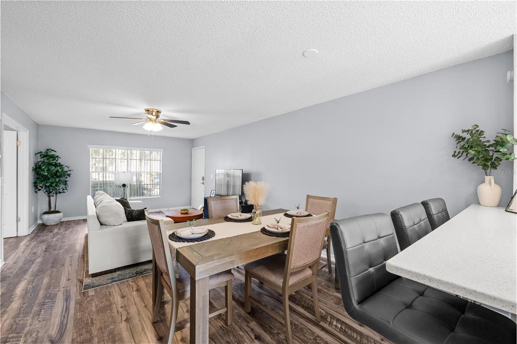4515 Whitton Way, Unit 117 New Port Richey, FL 34653 - Photo 10 of 35 a view of a dining room with furniture