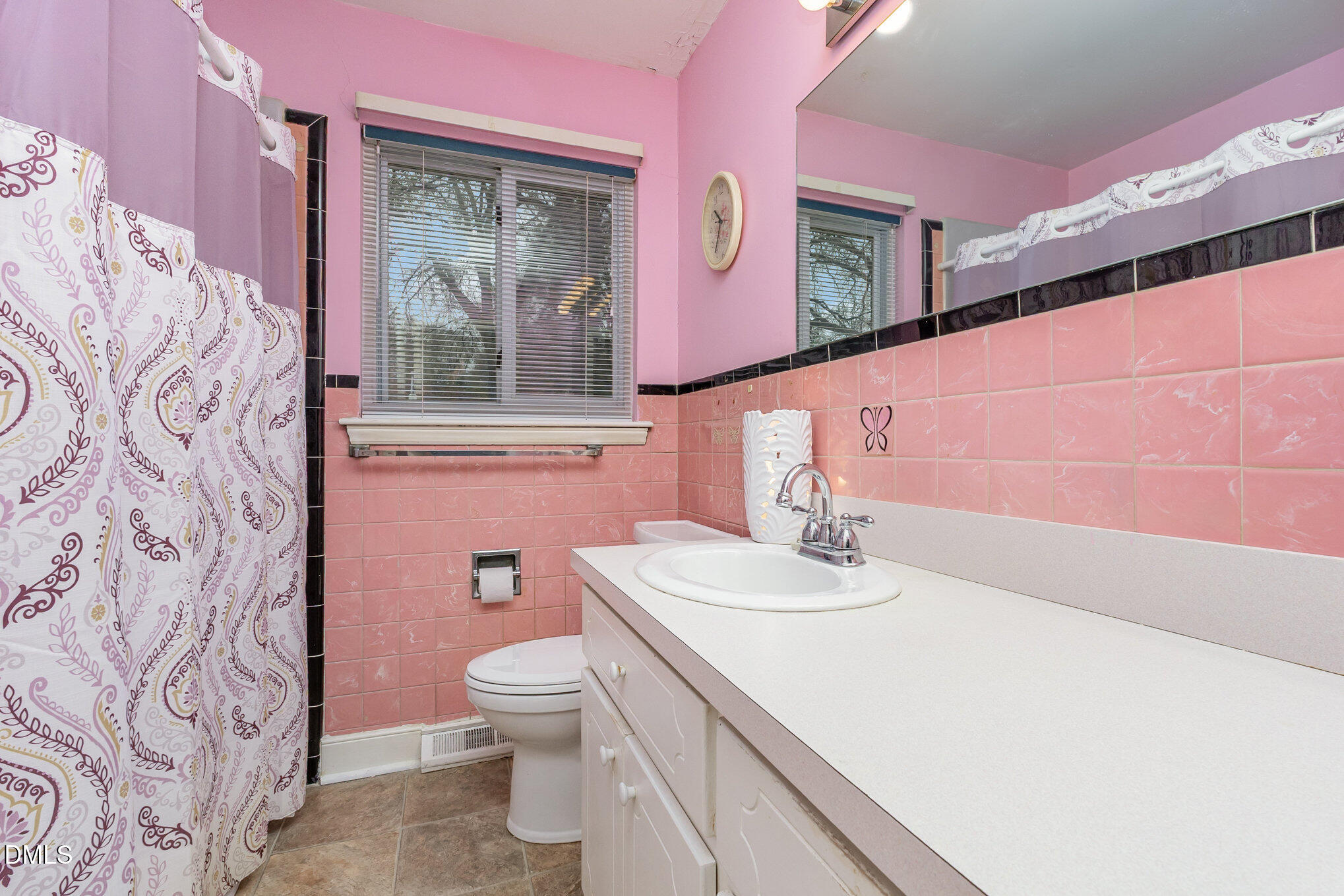 615 Horton Road Durham, NC 27704 - Photo 12 of 19 a bathroom with a sink vanity granite and toilet