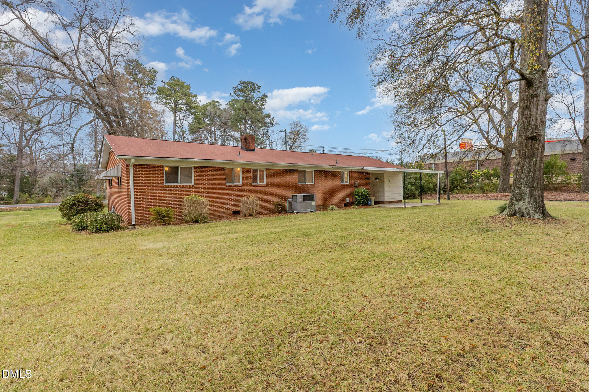 615 Horton Road Durham, NC 27704 - Photo 15 of 19 a view of a house with backyard and trees
