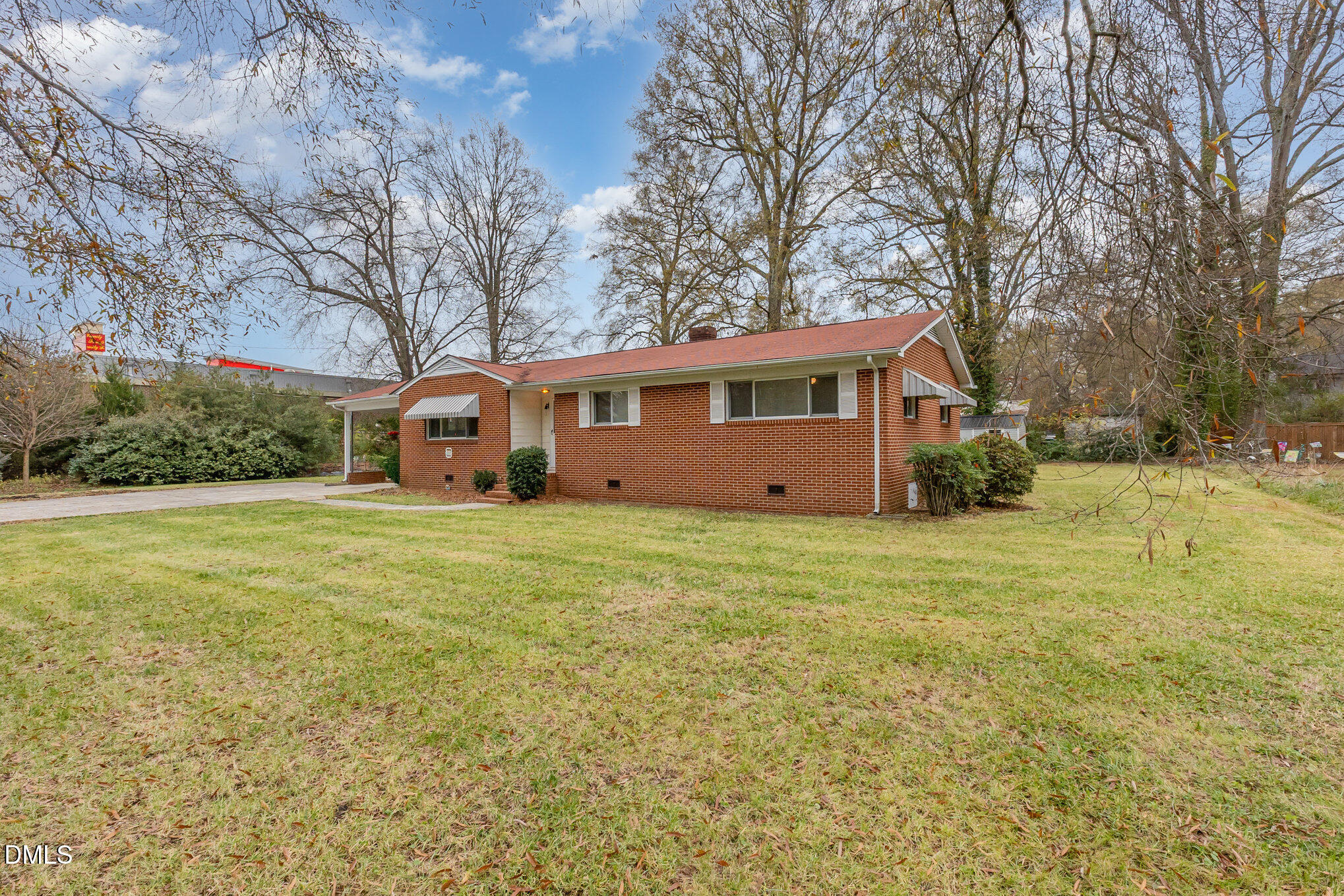 615 Horton Road Durham, NC 27704 - Photo 18 of 19 a front view of house with yard and trees in the background