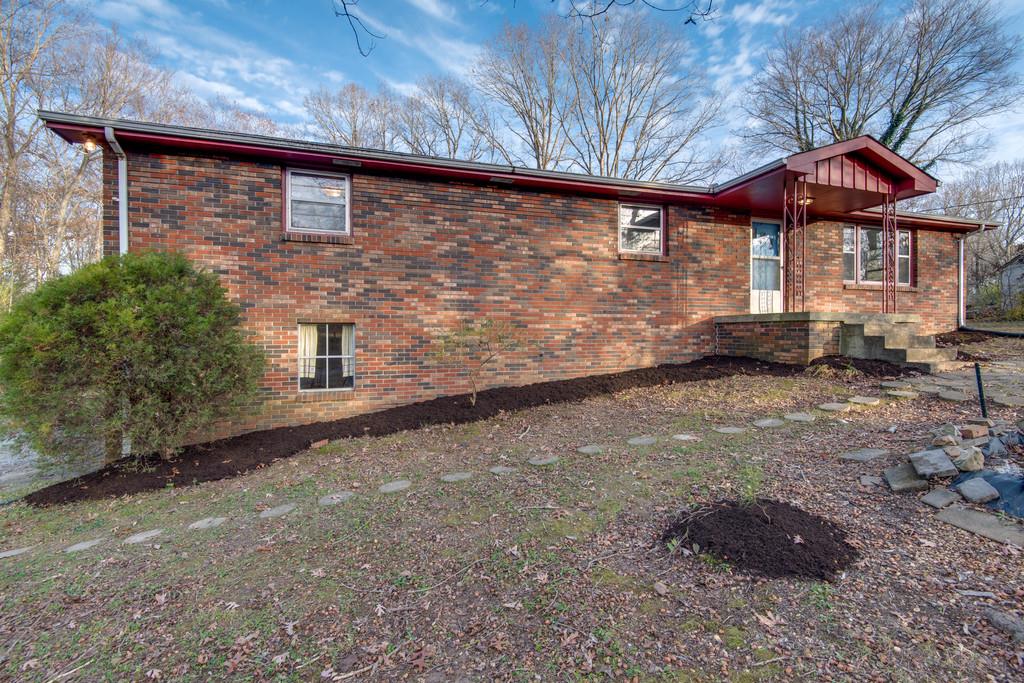103 Cardinal Road Dickson, TN 37055 - Photo 2 of 24 a front view of a house with garden