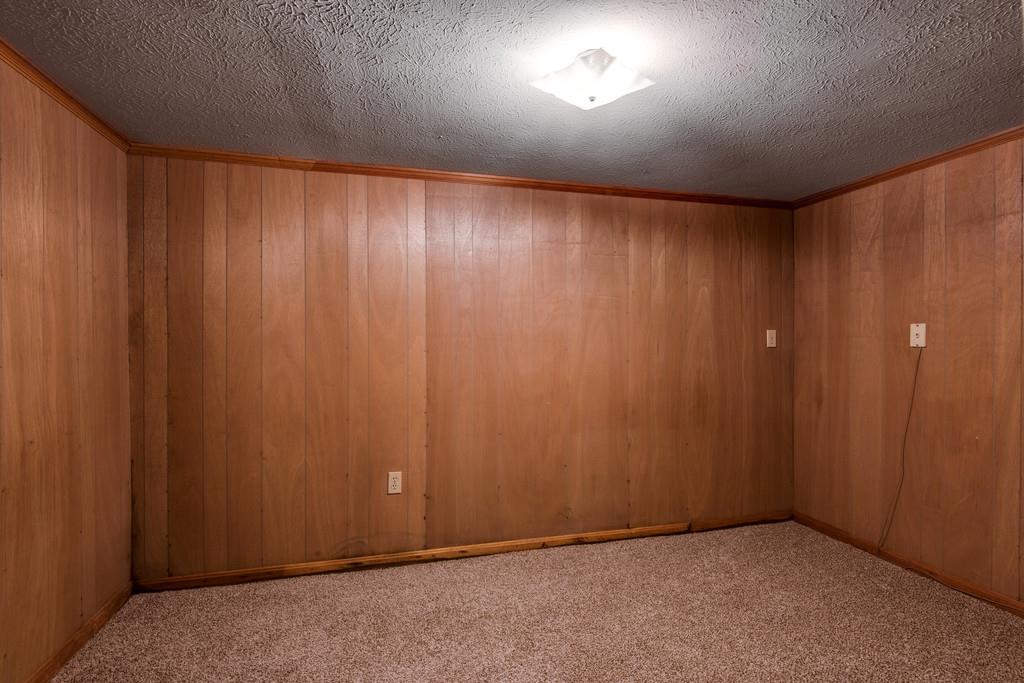 103 Cardinal Road Dickson, TN 37055 - Photo 23 of 24 an empty room with a wooden door