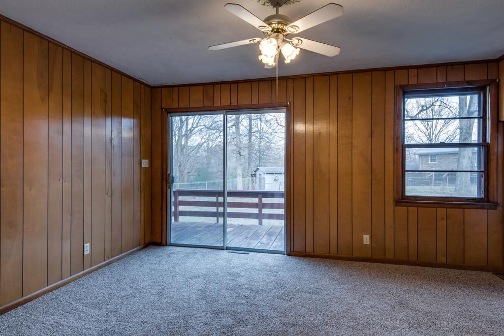 103 Cardinal Road Dickson, TN 37055 - Photo 8 of 24 an empty room with windows closet and chandelier fan