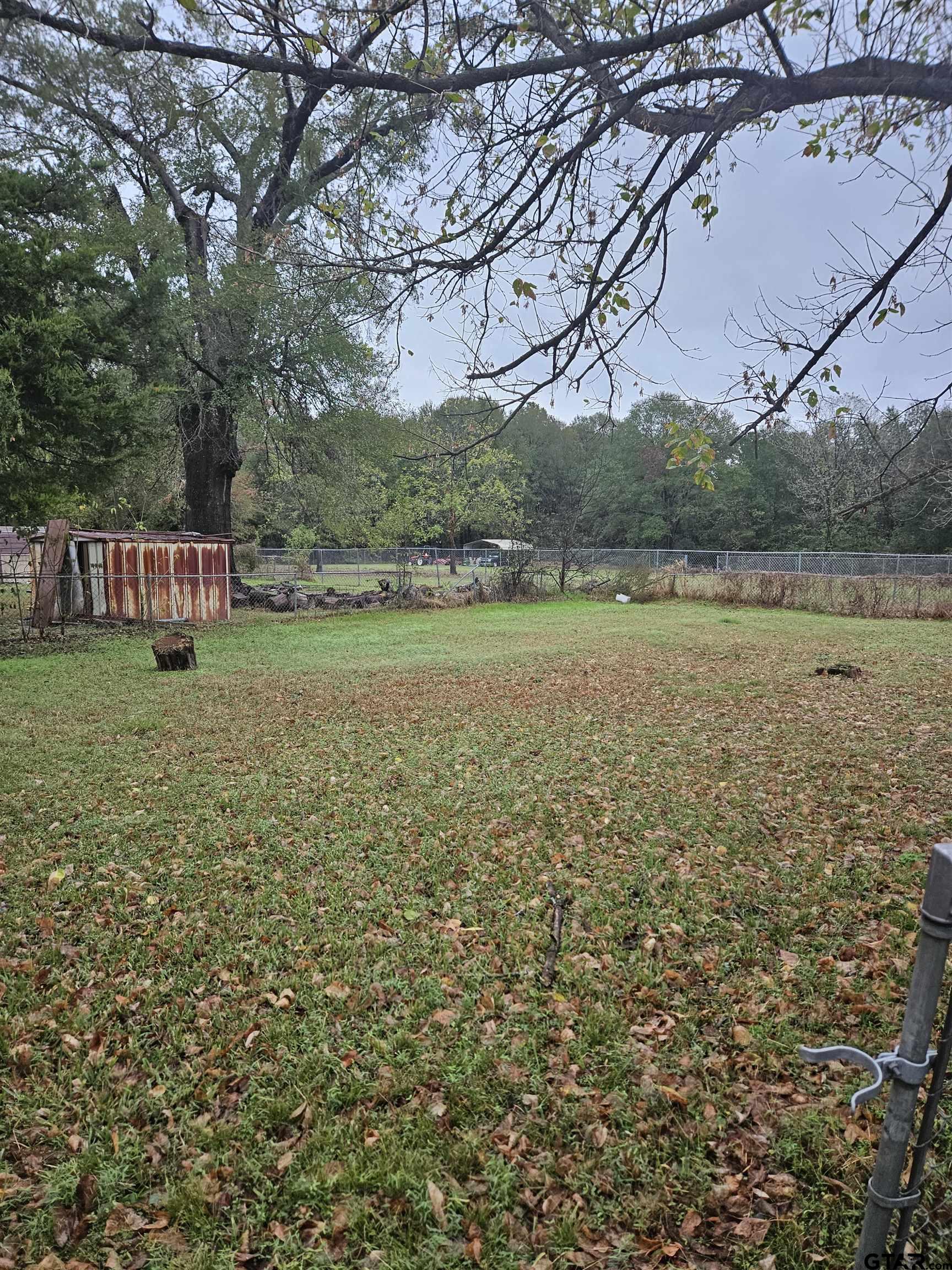 3309 North Luberta Street Tyler, TX 75702 - Photo 12 of 14 a backyard of a house with lots of green space