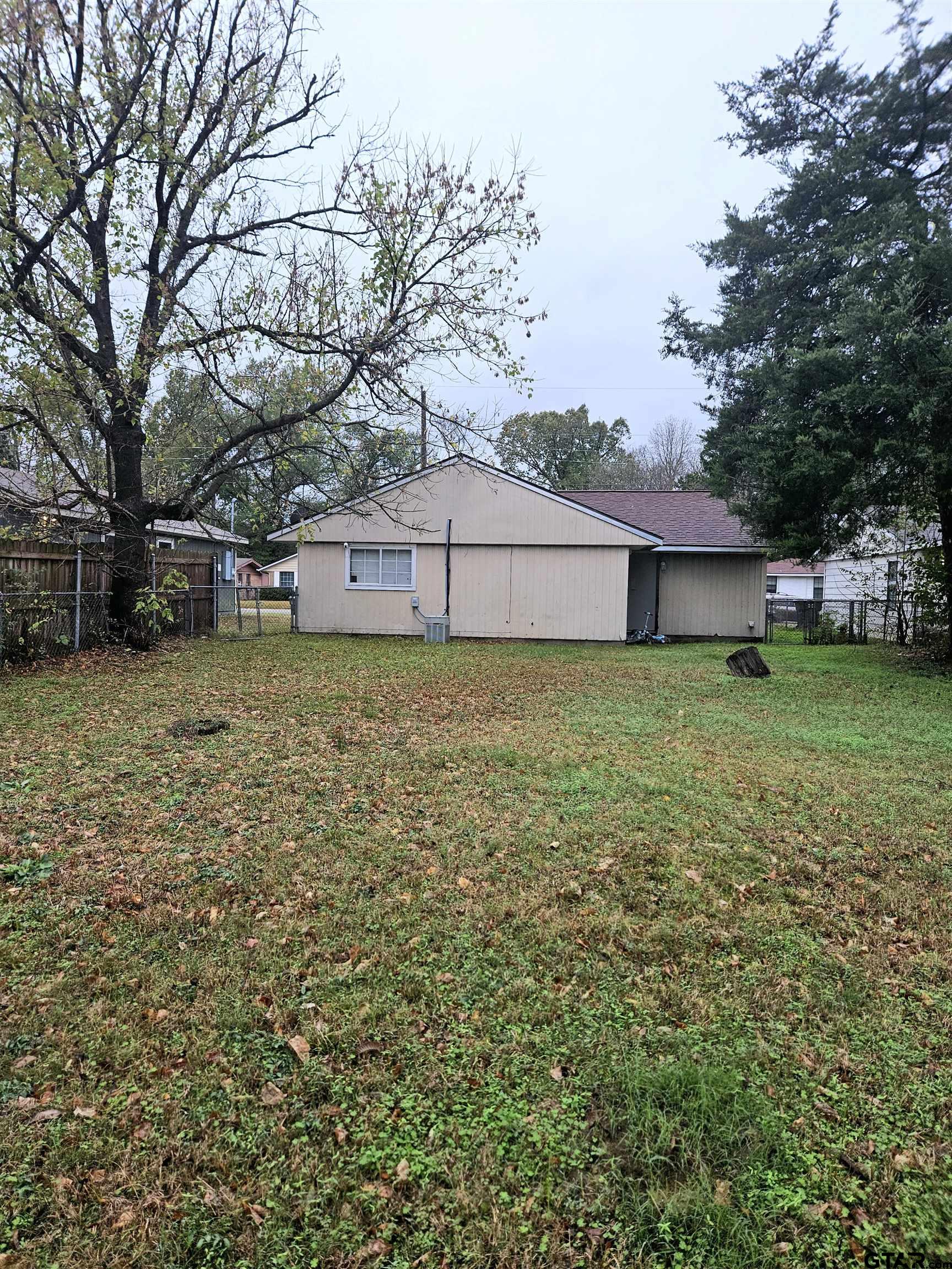 3309 North Luberta Street Tyler, TX 75702 - Photo 13 of 14 a view of a tree in front of a house