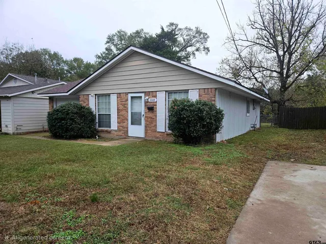 a view of a house with yard and a garden