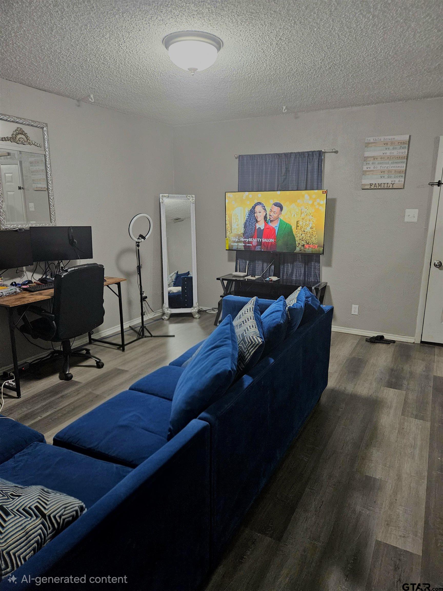 3309 North Luberta Street Tyler, TX 75702 - Photo 3 of 14 a living room with furniture and a flat screen tv