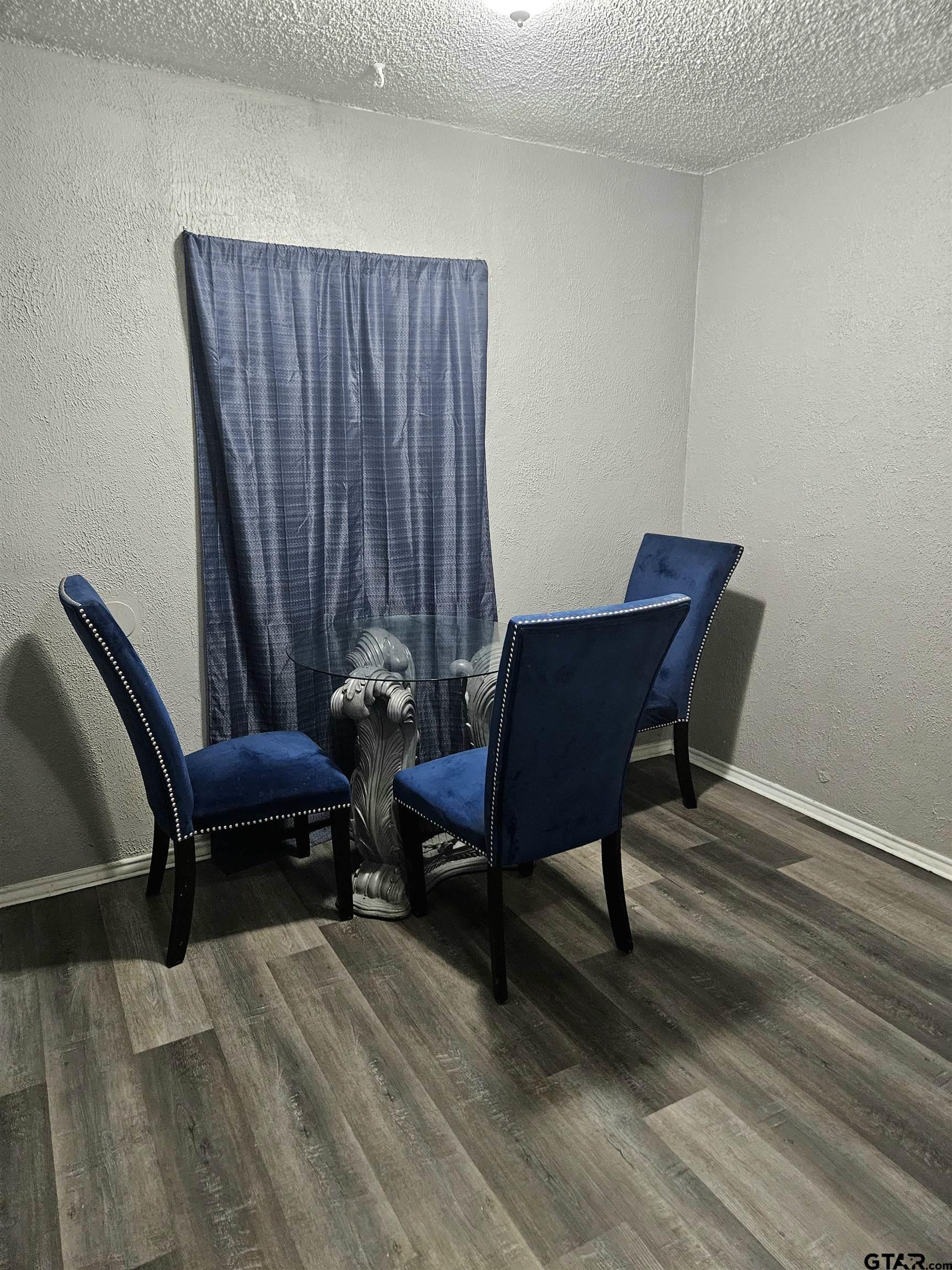 3309 North Luberta Street Tyler, TX 75702 - Photo 4 of 14 a view of a workspace with furniture and wooden floor