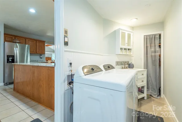 a bedroom with furniture and a chandelier