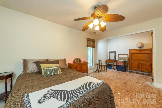 a room with pool table and windows