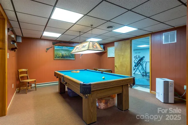 a room with lots of furniture and windows