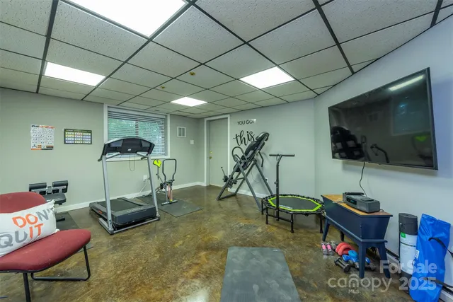 a bathroom with a sink a toilet and shower curtain