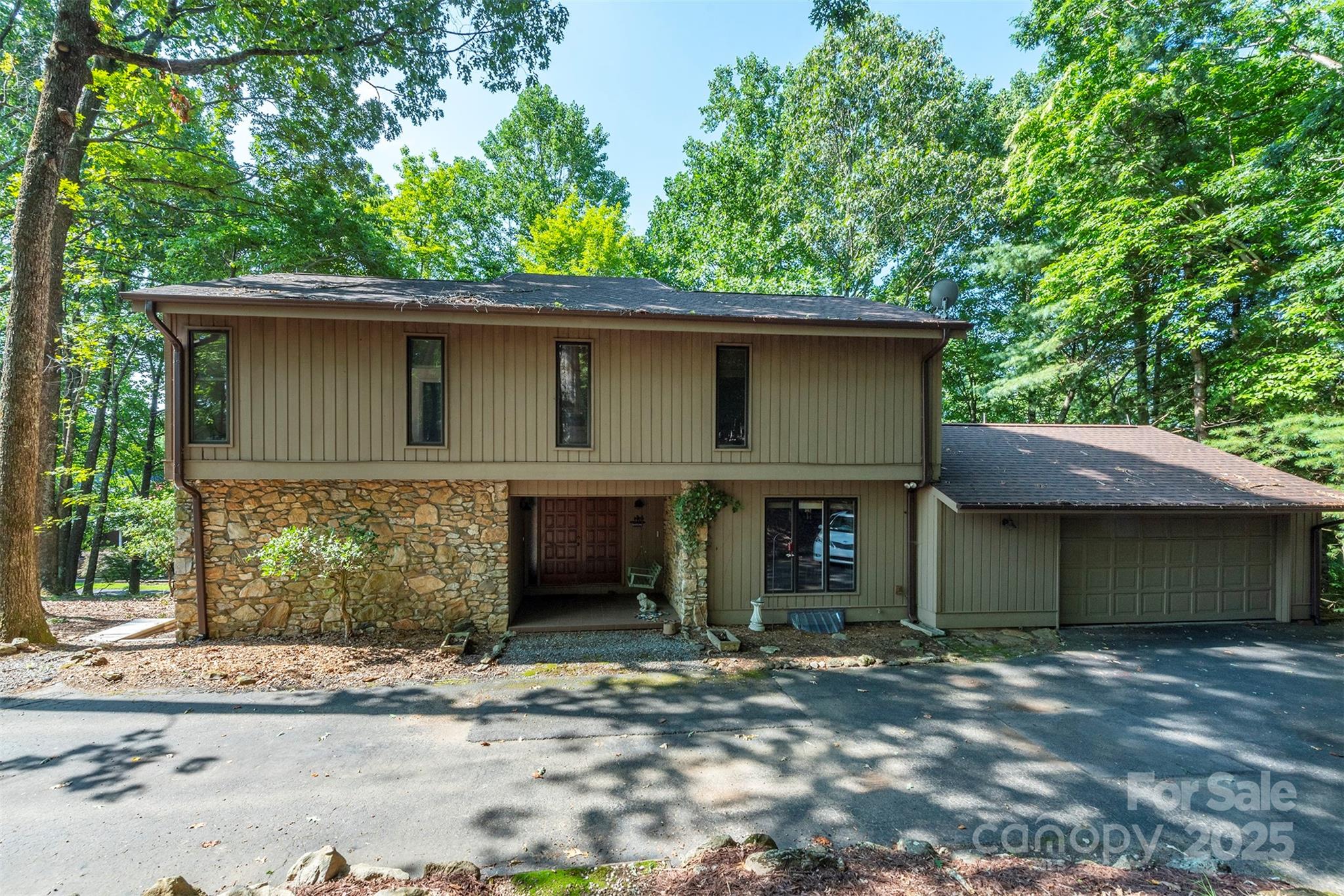 10 Chestnut Ridge Road Mills River, NC 28759 - Photo 29 of 47 a front view of a house with a garden