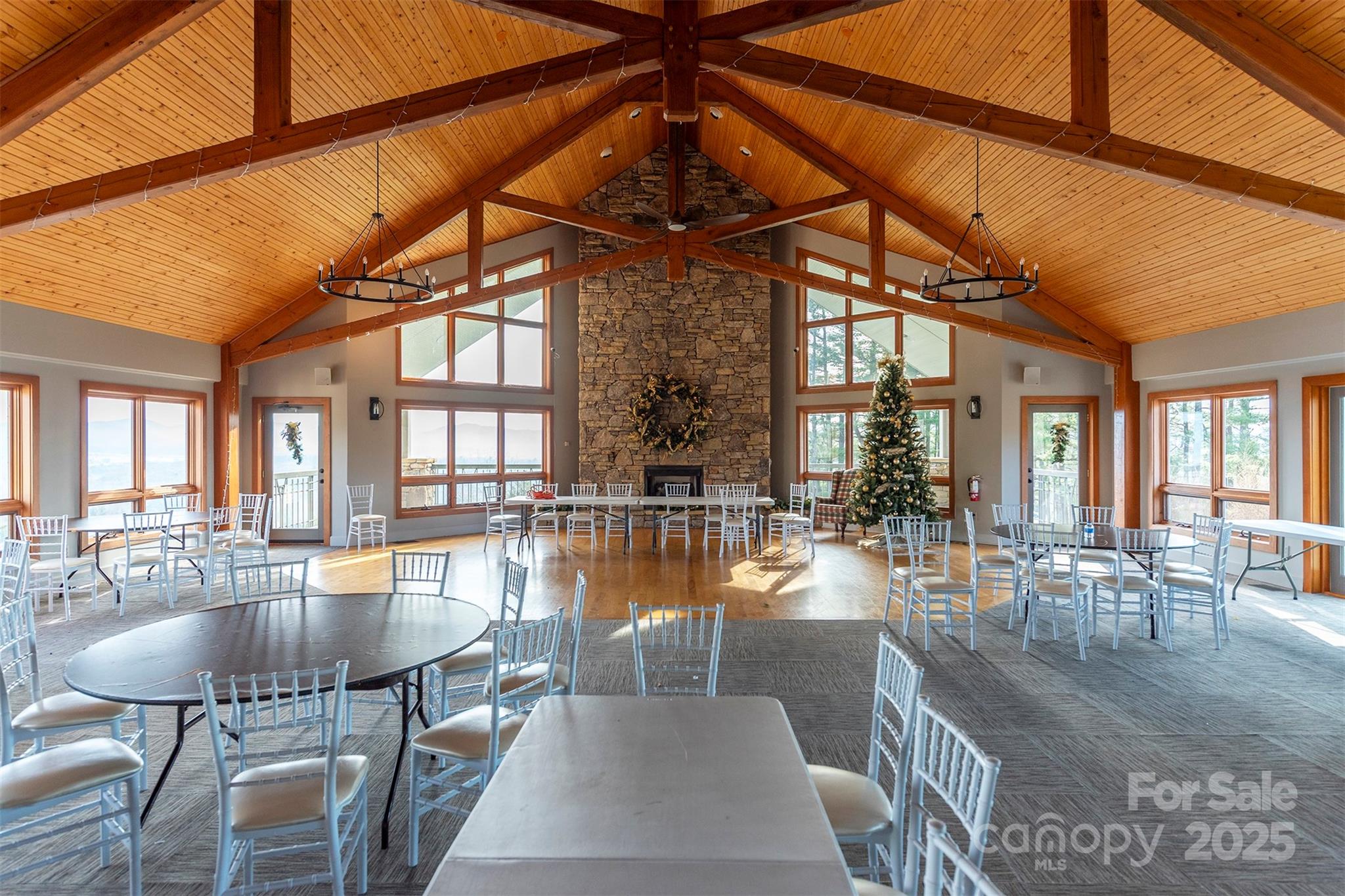 10 Chestnut Ridge Road Mills River, NC 28759 - Photo 38 of 47 a dining room with furniture a chandelier and wooden floor