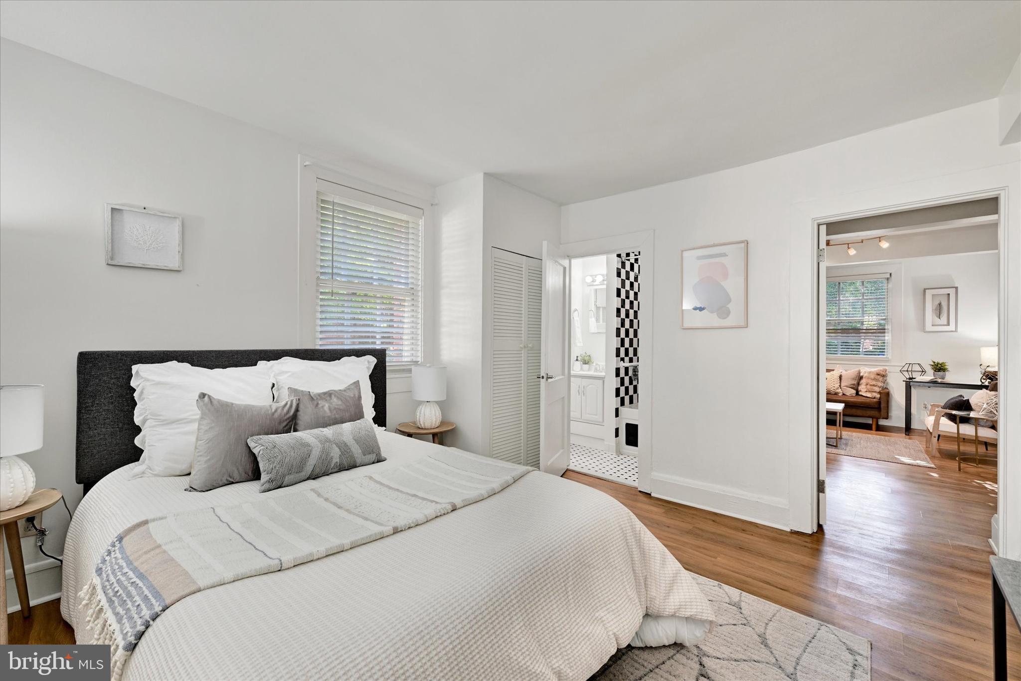 220 Stony Run Lane, Unit DG Baltimore, MD 21210 - Photo 6 of 13 a bedroom with bed and window