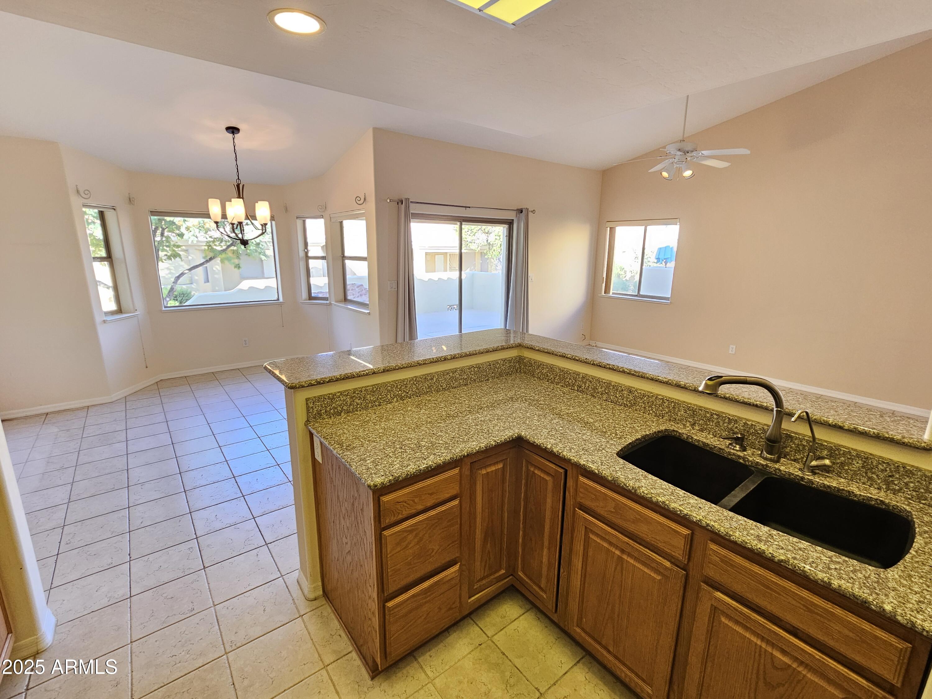 5830 East McKellips Road, Unit 139 Mesa, AZ 85215 - Photo 13 of 53 a kitchen with a sink and cabinets