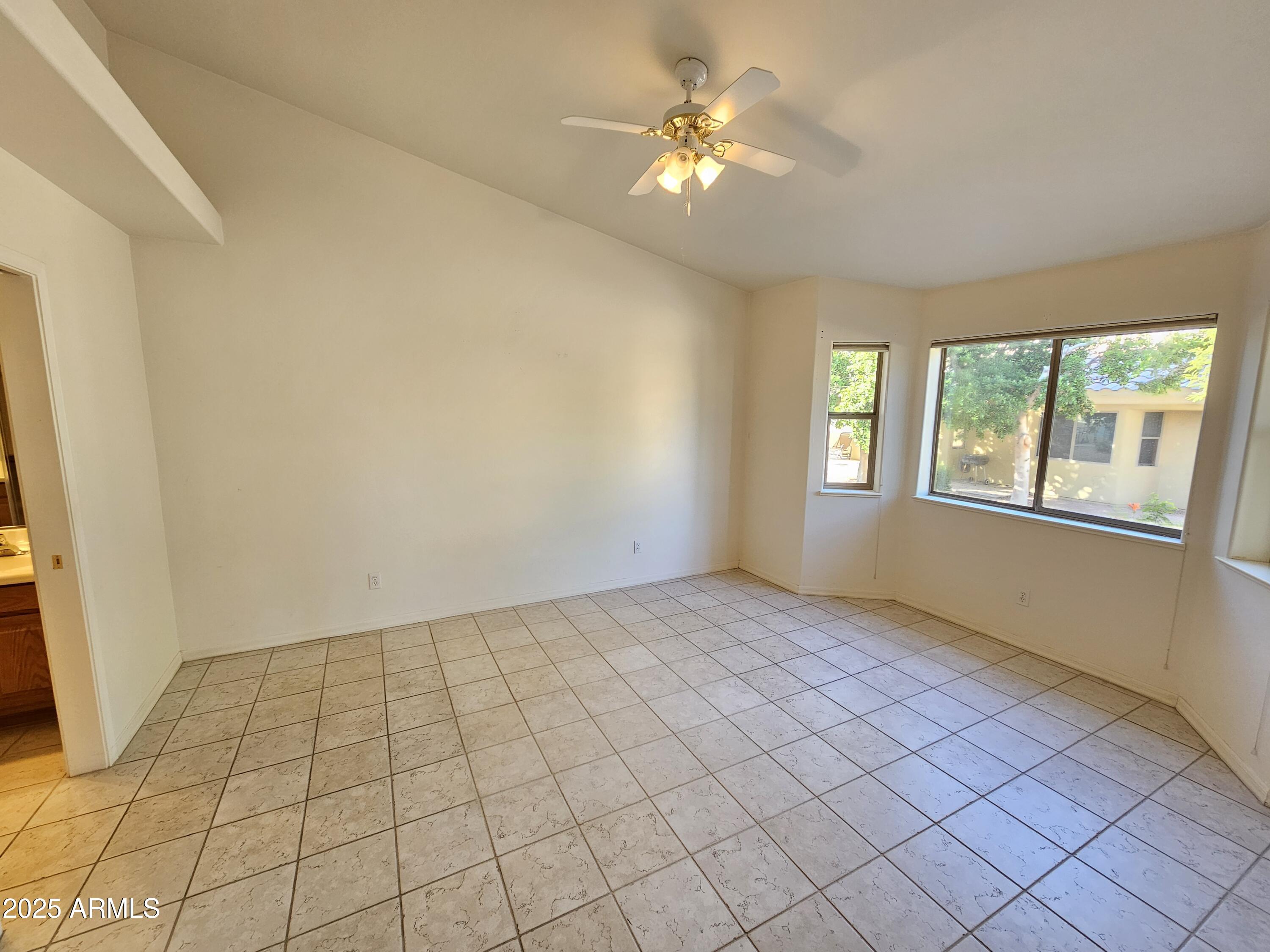 5830 East McKellips Road, Unit 139 Mesa, AZ 85215 - Photo 16 of 53 an empty room with windows