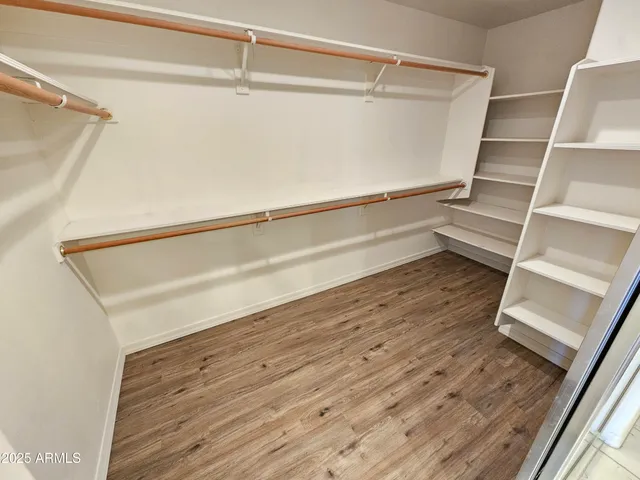 a view of a bathroom with a sink and a mirror