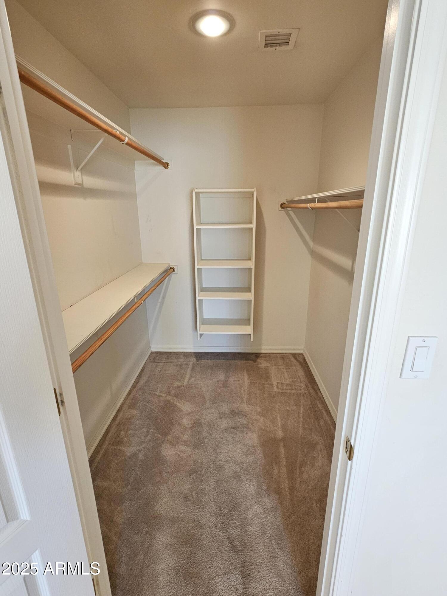 5830 East McKellips Road, Unit 139 Mesa, AZ 85215 - Photo 27 of 53 a view of an empty walk in closet