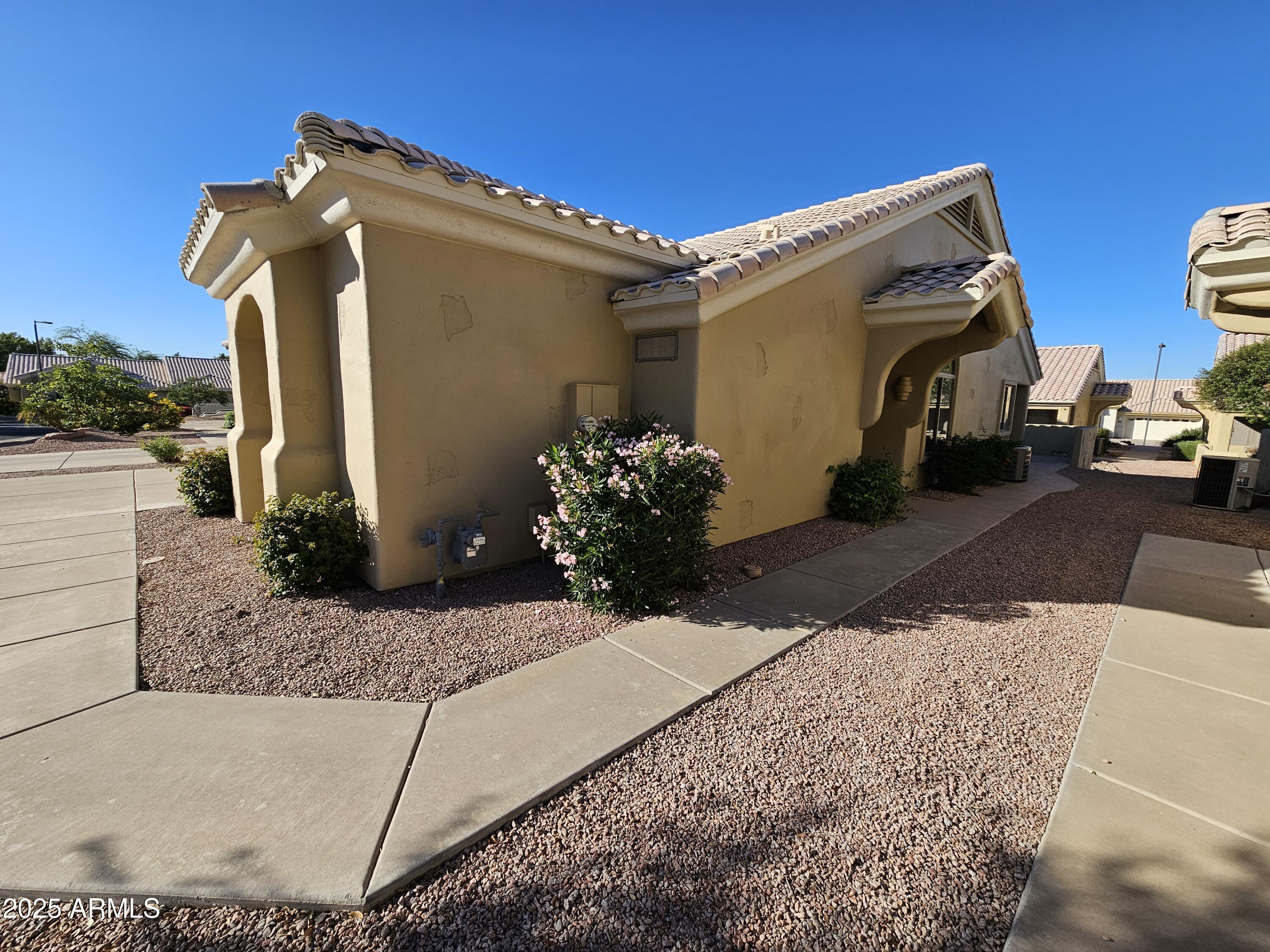 5830 East McKellips Road, Unit 139 Mesa, AZ 85215 - Photo 3 of 53 a view of a house with a street
