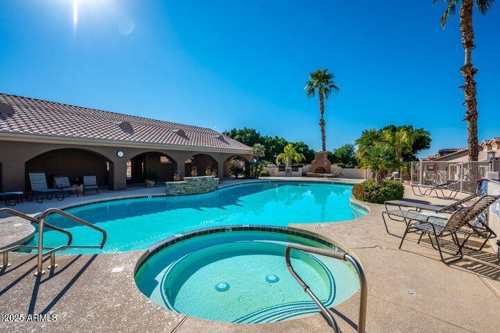 5830 East McKellips Road, Unit 139 Mesa, AZ 85215 - Photo 44 of 53 a view of a swimming pool with a patio
