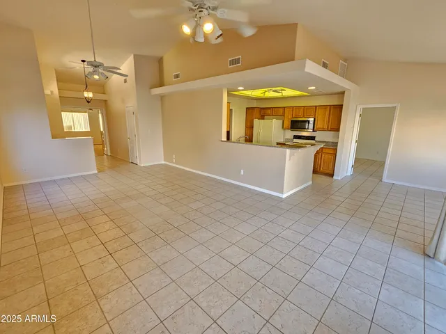 a kitchen with stainless steel appliances a stove a microwave and a refrigerator
