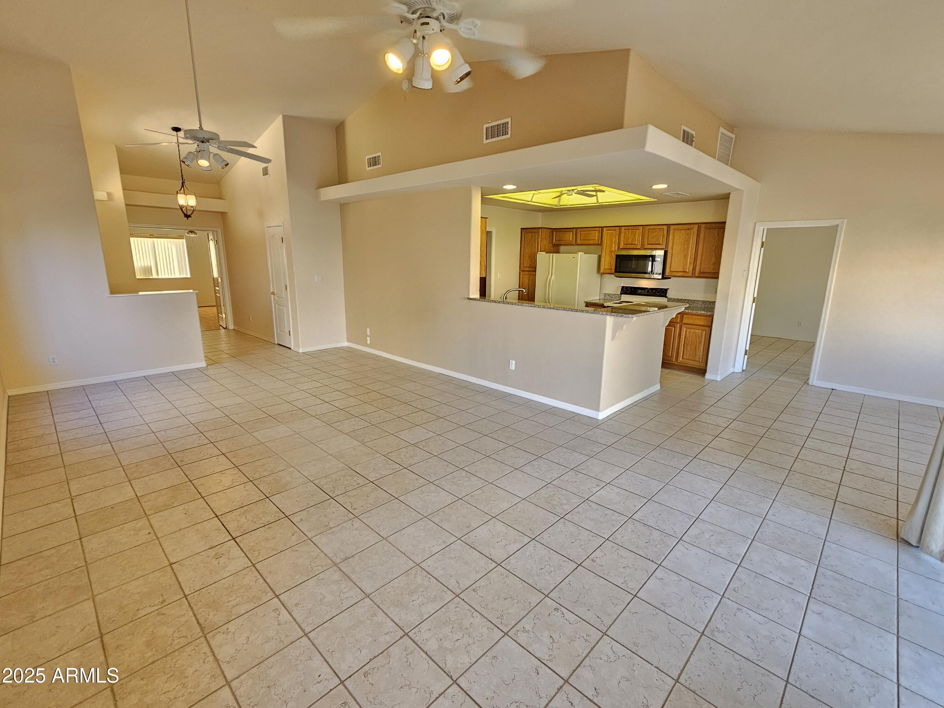 5830 East McKellips Road, Unit 139 Mesa, AZ 85215 - Photo 7 of 53 a view of a bathroom with a sink and a mirror