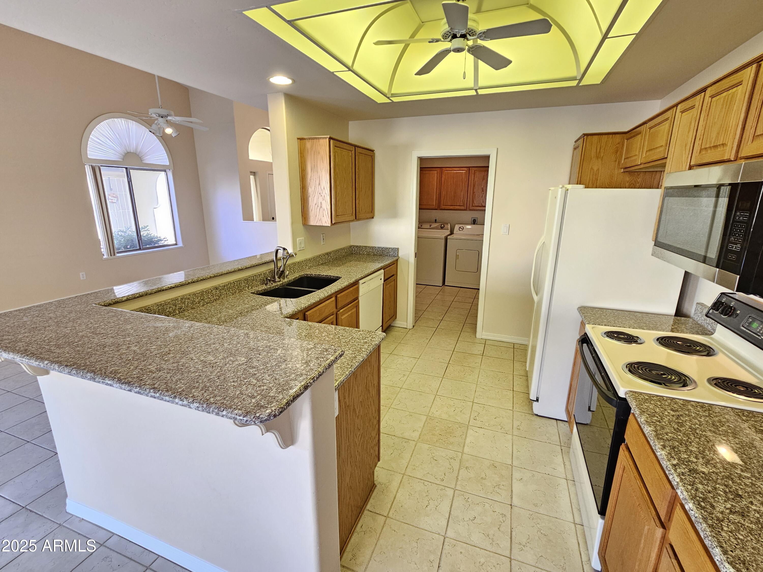 5830 East McKellips Road, Unit 139 Mesa, AZ 85215 - Photo 9 of 53 a bathroom with a sink a vanity and mirror
