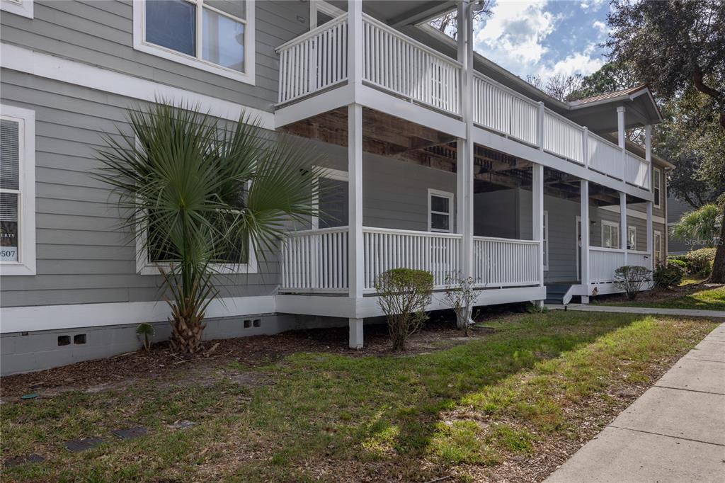 2905 Southwest Archer Road, Unit S4024 Gainesville, FL 32608 - Photo 1 of 19 a view of a house with backyard and sitting area