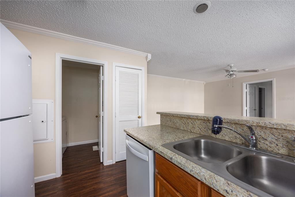 2905 Southwest Archer Road, Unit S4024 Gainesville, FL 32608 - Photo 11 of 19 a kitchen with a sink and a refrigerator